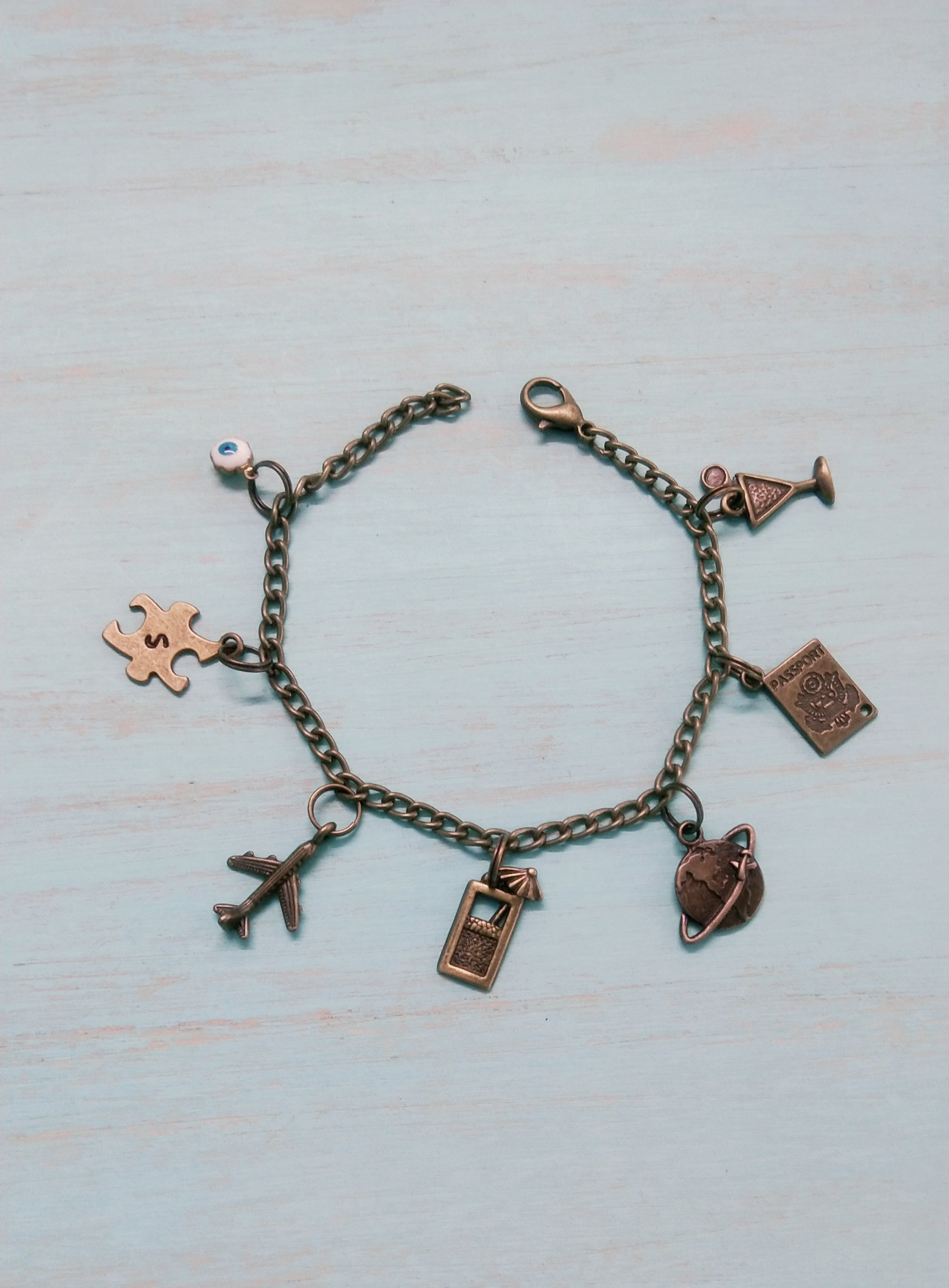 Travel charm bracelet with alphabet charm