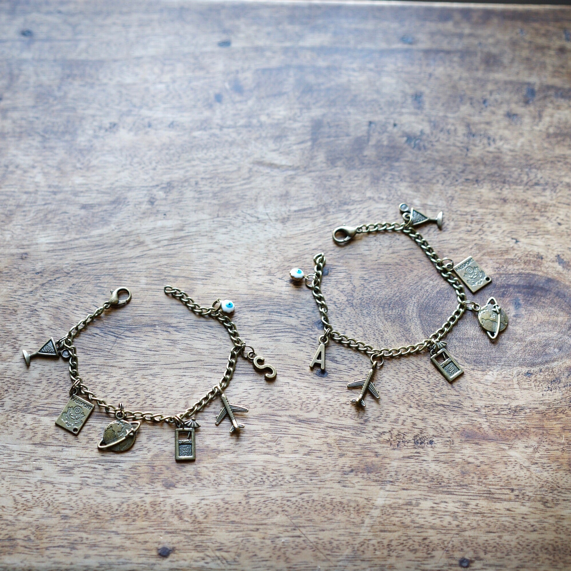 Set of 2 travel charm bracelets with alphabet charms